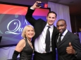 656219-4 : ©Lionel Heap : News : A Question of Brains Charity Event in Aid of Steps : Winner 2012.... A Question of Brains winner representing his table Leicester Tigers star Craig Newby (centre) collects the trophy from event organiser and Steps patron Rosemary Conley (left) & special guest freerunning founder Sebastian Foucan (right).