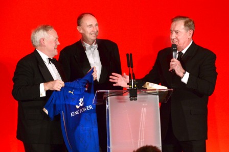 656410-05 : @Lionel Heap : News : A Question of Brains 2015 Charity Dinner in AId of Steps Conductive Education Centre in Shepshed : Auction... local sporting legends (from left) Peter Wheeler, Jonathan Agnew and Alan Birchenall auction a signed Leicester City shirt which helped towards raising £75,000 for Steps.