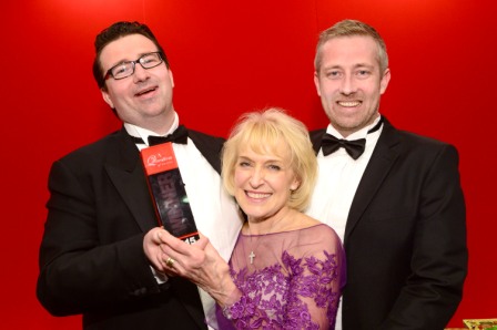 656410-04 : @Lionel Heap : News : A Question of Brains 2015 Charity Dinner in AId of Steps Conductive Education Centre in Shepshed : 2015 A Question of Brains Champions, The Healy Group L-R Collecting the trophy from Steps patron Rosemary Conley are team captains Gareth Healy (left) and Anthony Healy (right). The event raised £75,000 for Steps.