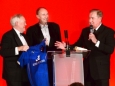 656410-05 : @Lionel Heap : News : A Question of Brains 2015 Charity Dinner in AId of Steps Conductive Education Centre in Shepshed : Auction... local sporting legends (from left) Peter Wheeler, Jonathan Agnew and Alan Birchenall auction a signed Leicester City shirt which helped towards raising £75,000 for Steps.