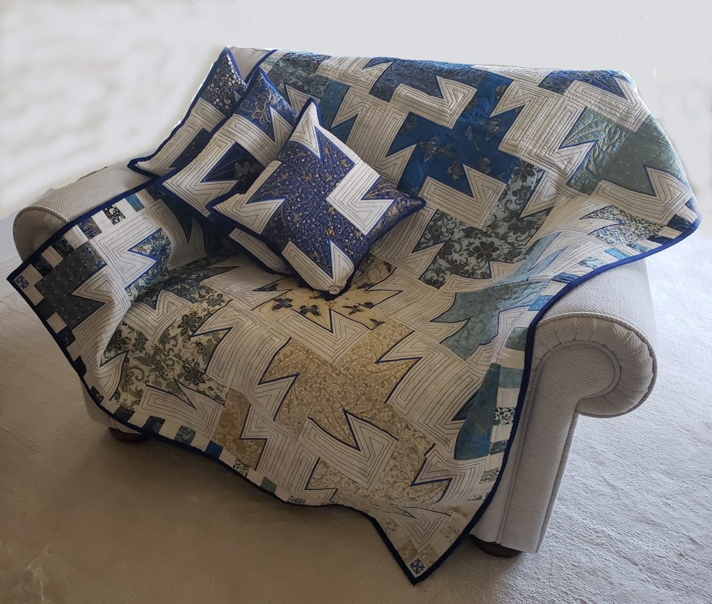 1. Beautifully crafted hand-made Appliqué throw with three matching cushions.